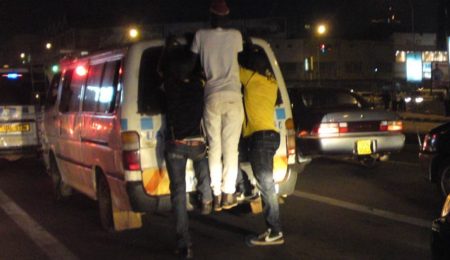 boys joy riding matatu Kampala