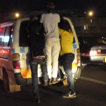 boys joy riding matatu Kampala