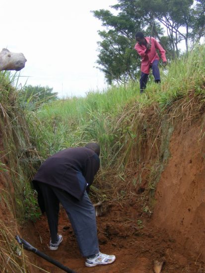 UCOTA elephant trench maintenance. Deo's model homestead, Ishasha