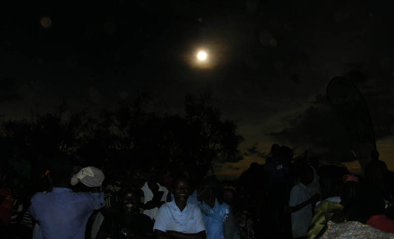 People watching hybrid solar eclipse Uganda, Pokwero