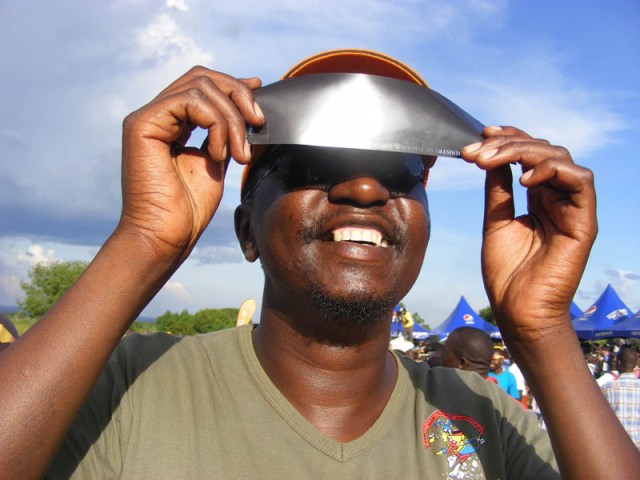 Man looking at solar eclipse