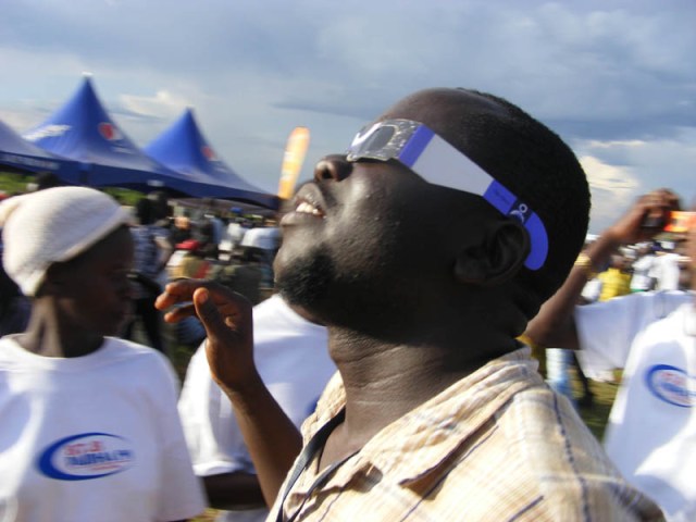 Man looking at solar eclipse