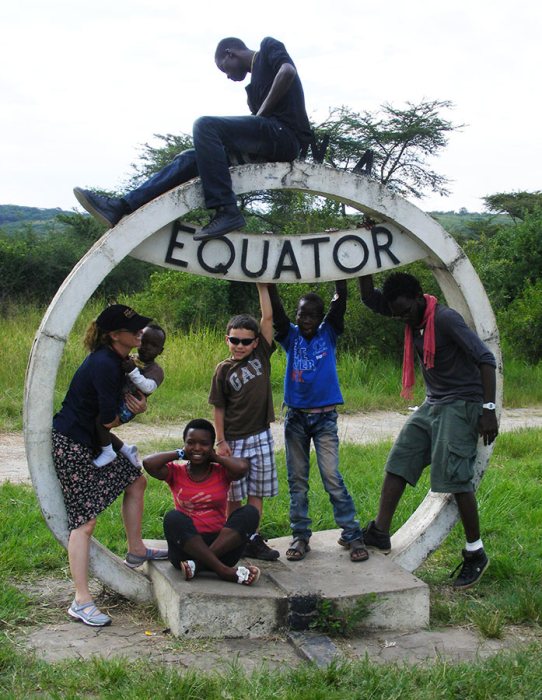 family pose, Queen Elizabeth Equator, Uganda