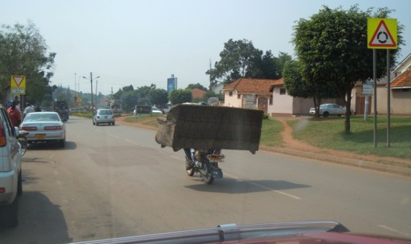 Moving house Ugandan style. PHOTO Mark Thriscutt